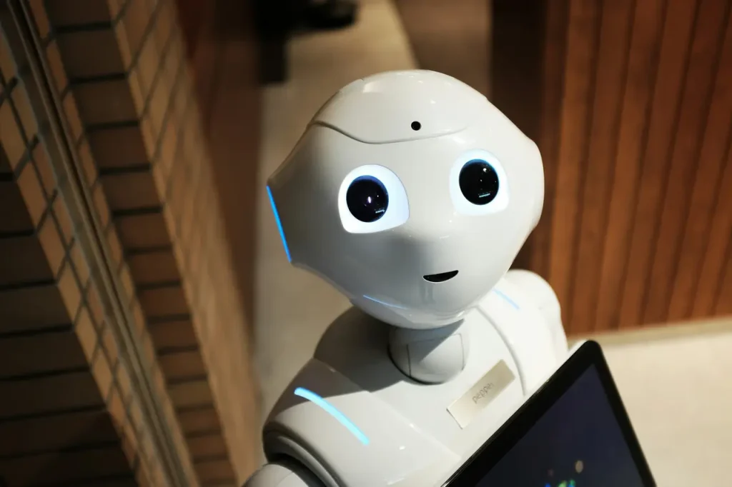 Ilustracja przedstawiająca nowoczesne roboty współpracujące z ludźmi w biurze, symbolizująca szansę na rozwój biznesu.
